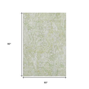 HomeRoots 5' X 8' Green and Ivory Abstract Washable Area Rug with UV Protection for High-Traffic Spaces 666809