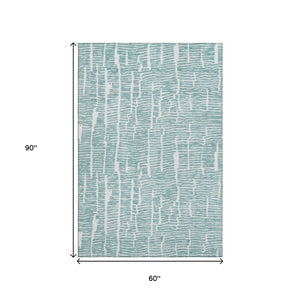 HomeRoots 5' X 8' Teal and Ivory Washable Area Rug with UV Protection - Soft, Durable, Stylish for Every Home 666862