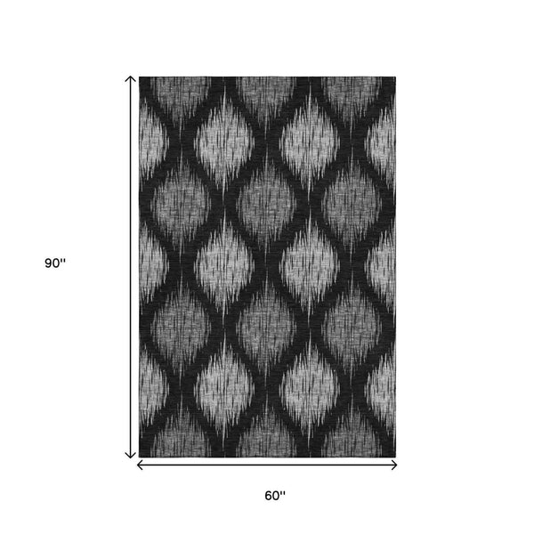 HomeRoots 5' X 8' Modern Black and Ivory Ikat Washable Area Rug with UV Protection for High-Traffic Spaces 667451