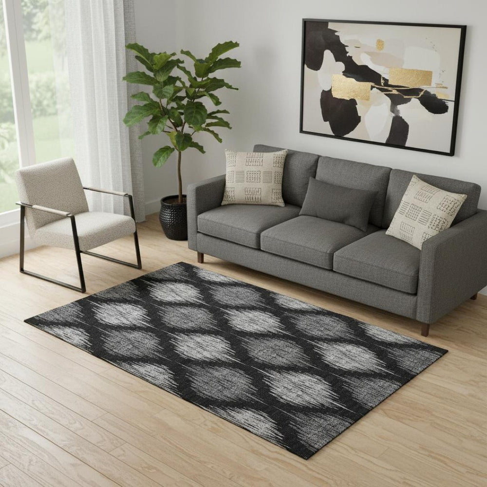 HomeRoots 5' X 8' Modern Black and Ivory Ikat Washable Area Rug with UV Protection for High-Traffic Spaces 667451