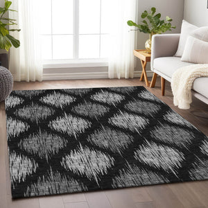 HomeRoots 9' X 12' Ikat Area Rug in Black and Ivory - Stylish, Washable, Stain Resistant with UV Protection 667454
