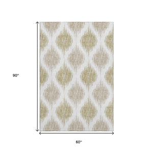 HomeRoots 5' X 8' Ikat Area Rug in Gold & Ivory - Stylish, Washable, UV-Protected for Busy Homes & Easy Care 667475