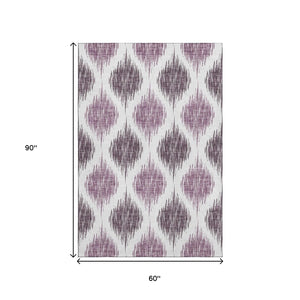 HomeRoots 5' X 8' Ikat Area Rug in Purple & Ivory – Washable, UV Protected, Stain Resistant, Durable Design 667493