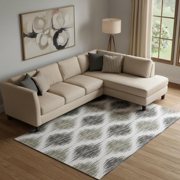 HomeRoots 9' X 12' Taupe and Ivory Ikat Area Rug - Washable, UV Protected, Perfect for High-Traffic Spaces! 667508
