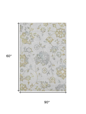 HomeRoots 5' X 8' Elegant Silver Gray and Gold Floral Area Rug - Washable, UV Protected, Pet-Friendly Design 667941