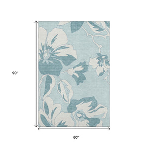 HomeRoots 5' X 8' Teal and Ivory Floral Area Rug - Durable, Washable, Stain Resistant with UV Protection! 668019