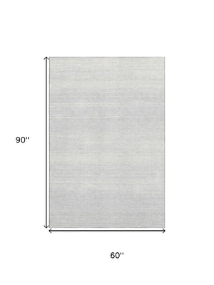 HomeRoots 5' X 8' Modern Silver and Gray Striped Washable Area Rug with UV Protection for Easy Care & Durability 668183