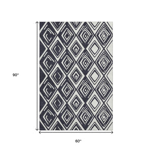 HomeRoots 5' X 8' Black And Ivory Geometric Area Rug - Washable, Stain-Resistant, UV-Protected for Busy Homes 668381
