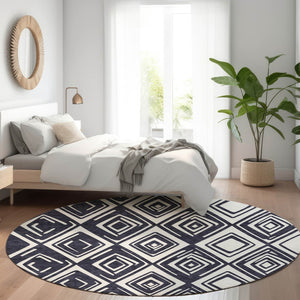 HomeRoots 8' Black and Ivory Geometric Round Rug - Washable, UV-Protected, Stain-Resistant for Modern Spaces 668382