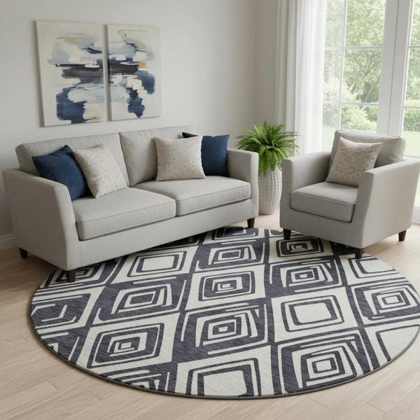 HomeRoots 8' Black and Ivory Geometric Round Rug - Washable, UV-Protected, Stain-Resistant for Modern Spaces 668382