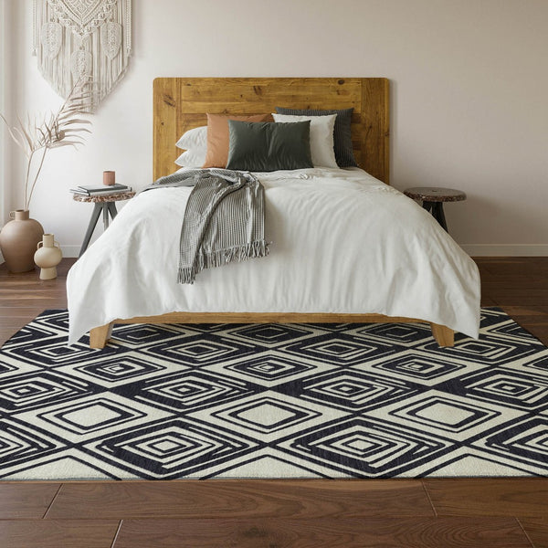 HomeRoots 8' X 10' Black And Ivory Geometric Area Rug - Washable, UV-Protected, Perfect for Modern Homes! 668383