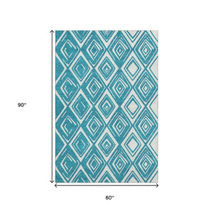 HomeRoots 5' X 8' Teal and Ivory Geometric Area Rug – Washable, UV-Protected, Stylish & Pet-Friendly Design! 668459