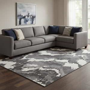 HomeRoots 8' X 10' Stylish Black and Ivory Abstract Washable Area Rug with UV Protection for Modern Living Spaces 668625