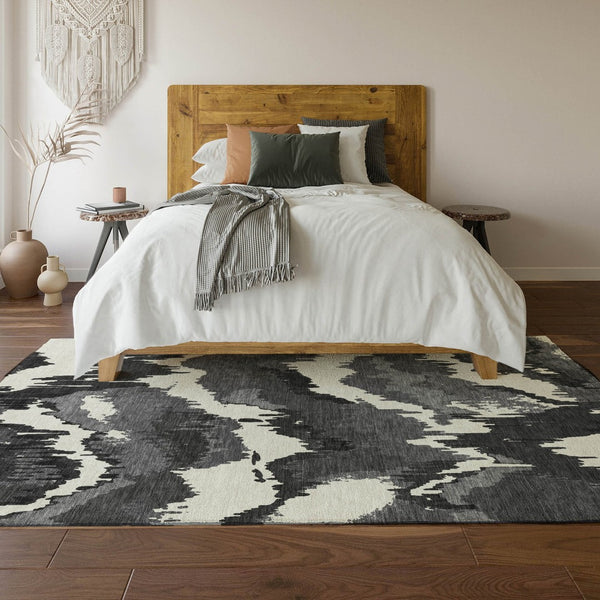 HomeRoots 10' X 14' Black And Ivory Abstract Area Rug - Washable, Durable, UV Protected for Stylish Living Spaces 668627