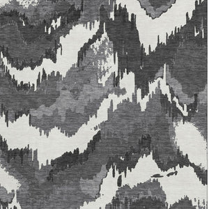 HomeRoots 10' X 14' Black And Ivory Abstract Area Rug - Washable, Durable, UV Protected for Stylish Living Spaces 668627