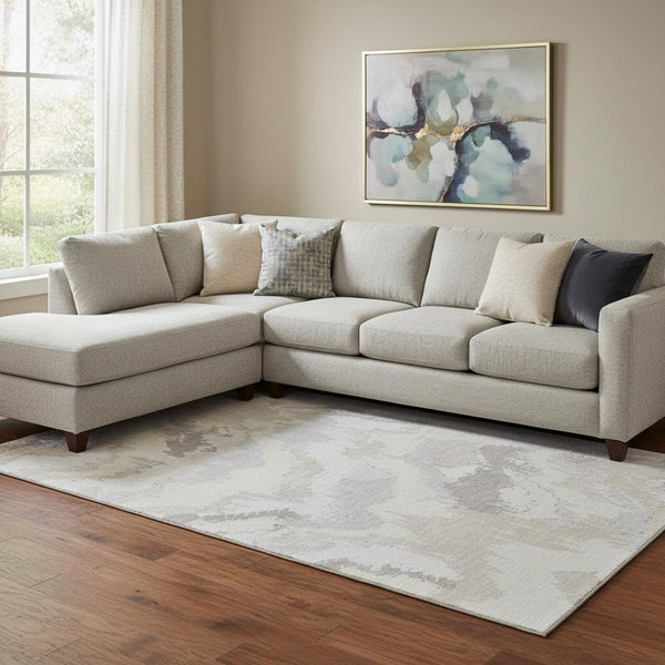 HomeRoots 10' X 14' Ivory and Beige Abstract Washable Area Rug - UV Protected, Soft, Stylish, Family-Friendly 668669