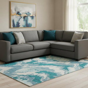 HomeRoots 9' X 12' Teal and Ivory Abstract Area Rug - Durable, Stain-Resistant, UV Protected for Modern Homes 668692