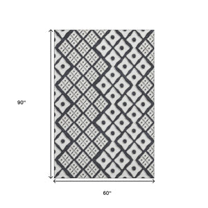 HomeRoots 5' X 8' Washable Black And Ivory Geometric Area Rug with UV Protection for High-Traffic Spaces 668708