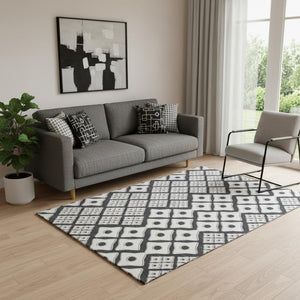 HomeRoots 5' X 8' Washable Black And Ivory Geometric Area Rug with UV Protection for High-Traffic Spaces 668708