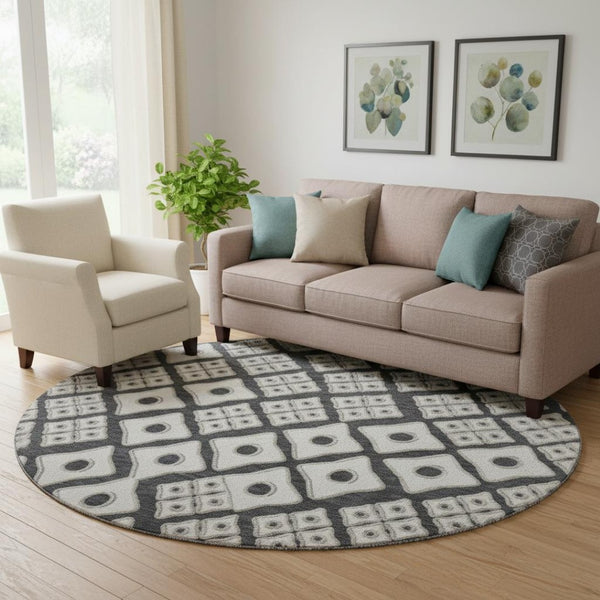 HomeRoots 8' Black And Ivory Geometric Round Rug - Washable, UV-Protected, Durable for High-Traffic Areas 668709