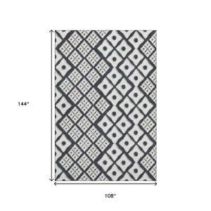 HomeRoots 9' X 12' Black And Ivory Geometric Area Rug - Stylish, Washable, UV-Protected for High-Traffic Spaces 668711