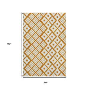 HomeRoots 5' X 8' Orange and Ivory Geometric Area Rug - Washable, UV Protected, Stain Resistant for Busy Homes 668756