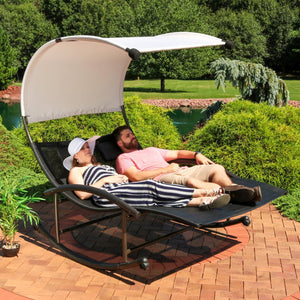 HomeRoots 70" Black Steel Sling Rocking Chaise Lounge with Adjustable Canopy for Ultimate Outdoor Comfort 668931