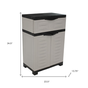 HomeRoots 35" Gray Heavy-Duty Plastic Utility Cabinet with Two Doors, One Drawer for Compact Storage Solutions 668936