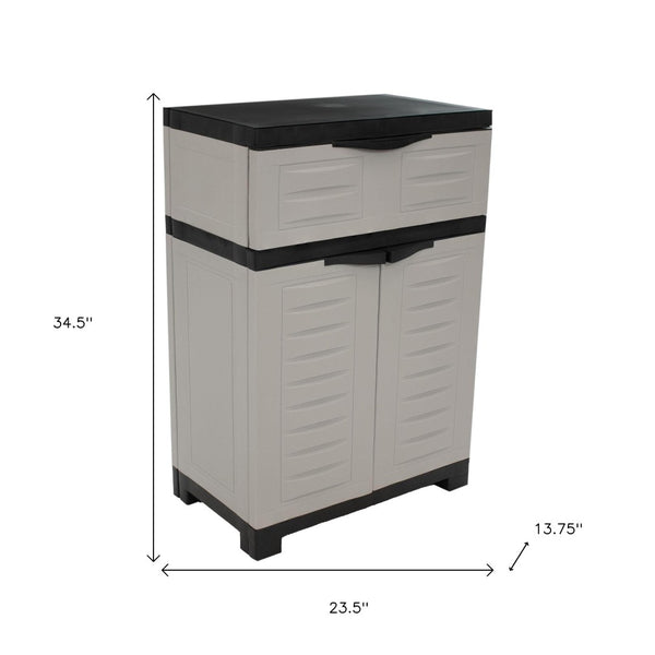HomeRoots 35" Gray Heavy-Duty Plastic Utility Cabinet with Two Doors, One Drawer for Compact Storage Solutions 668936