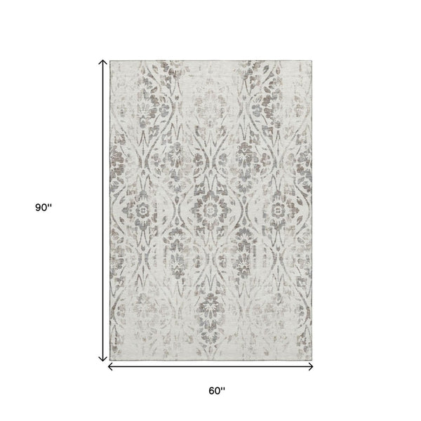 HomeRoots 5' X 8' Ivory And Beige Floral Area Rug - Washable, UV Protected, Stain Resistant for Busy Homes 669056