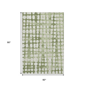 HomeRoots 5' X 8' Artichoke Green & Beige Polka Dot Washable Area Rug - Stylish, UV-Protected, Easy-Care Design 669086