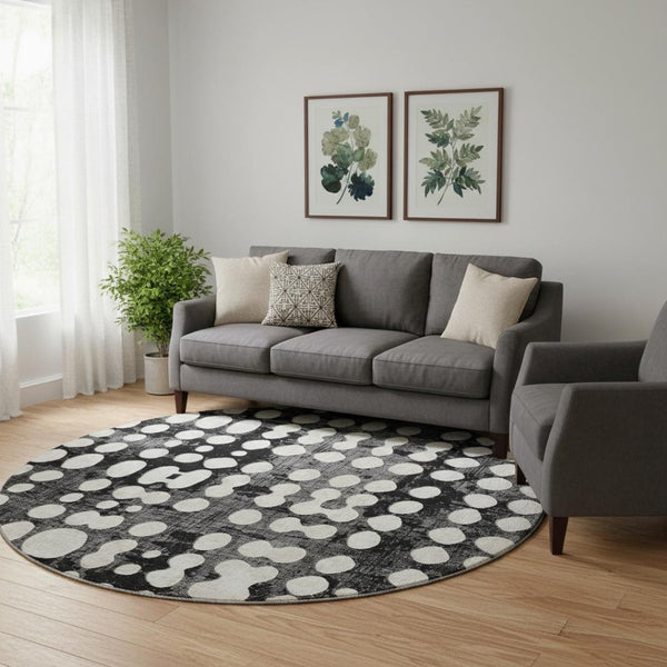 HomeRoots 8' Black and Ivory Polka Dot Washable Round Rug - UV Protection, Stylish, Durable, Easy-Clean Design 669093