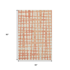 HomeRoots 5' X 8' Coral & Beige Polka Dot Area Rug – Soft, Washable, UV Protected for Stylish Durability! 669104
