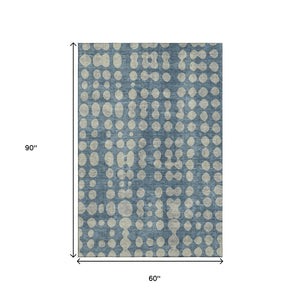HomeRoots 5' X 8' Denim Blue Beige Polka Dot Area Rug - Washable, UV Protected, Ideal for High-Traffic Spaces 669110