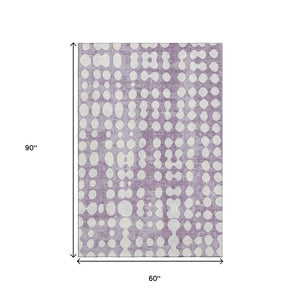 HomeRoots 5' X 8' Playful Purple and Ivory Polka Dot Washable Area Rug with UV Protection for Kids & Pets 669134
