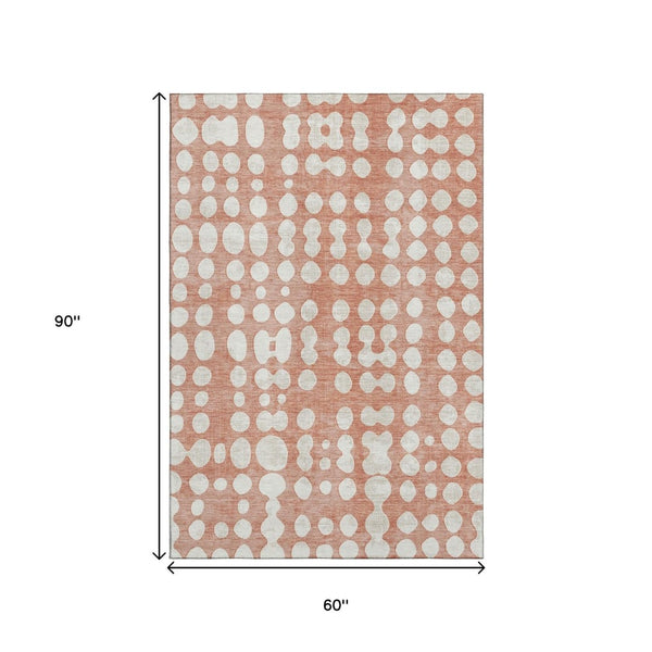 HomeRoots 5' X 8' Salmon and Ivory Polka Dot Area Rug – Stylish, Washable, UV-Protected for Family Spaces! 669140