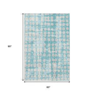 HomeRoots 5' Teal and Ivory Polka Dot Area Rug – Washable, UV-Protected, Stain-Resistant, Perfect for Families! 669152
