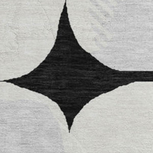 HomeRoots 8' Black and Ivory Abstract Geometric Washable Round Rug - Durable, Stylish & UV Resistant Design 669165