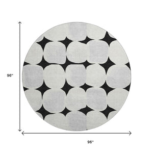 HomeRoots 8' Black and Ivory Abstract Geometric Washable Round Rug - Durable, Stylish & UV Resistant Design 669165
