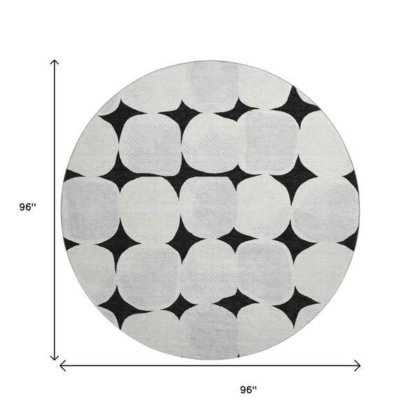 HomeRoots 8' Black and Ivory Abstract Geometric Washable Round Rug - Durable, Stylish & UV Resistant Design 669165