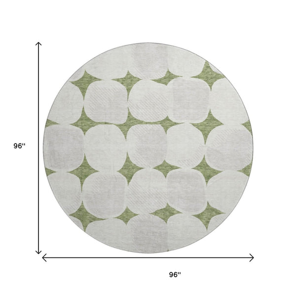 HomeRoots 8' Green and Ivory Abstract Geometric Round Rug - Washable, UV Protected, Perfect for High-Traffic Areas 669195