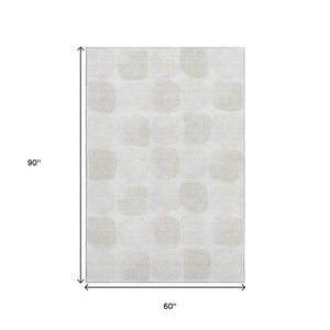 HomeRoots 5' X 8' Ivory and Beige Geometric Washable Area Rug with UV Protection, Perfect for High-Traffic Spaces 669200