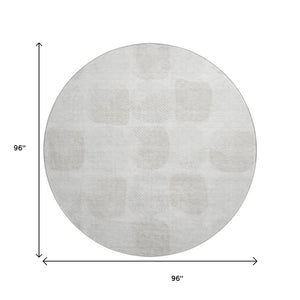 HomeRoots 8' Ivory and Beige Abstract Geometric Washable Round Rug with UV Protection for High-Traffic Areas 669201