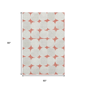 HomeRoots 5' X 8' Salmon and Ivory Abstract Geometric Area Rug – Washable, UV-Protected, and Low-Maintenance! 669230