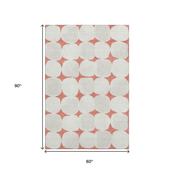 HomeRoots 5' X 8' Salmon and Ivory Abstract Geometric Area Rug – Washable, UV-Protected, and Low-Maintenance! 669230