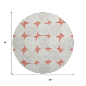 HomeRoots 8' Salmon and Ivory Abstract Geometric Round Rug - Washable, UV Protected, Perfect for High-Traffic Areas! 669231