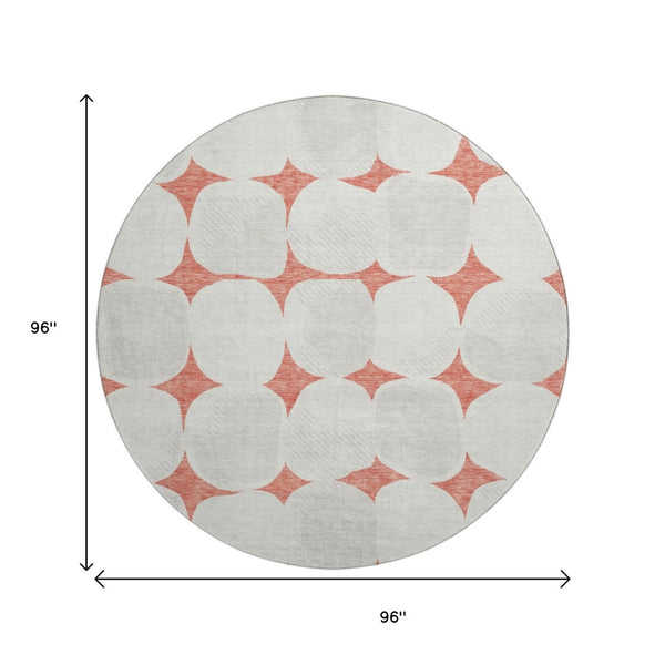 HomeRoots 8' Salmon and Ivory Abstract Geometric Round Rug - Washable, UV Protected, Perfect for High-Traffic Areas! 669231