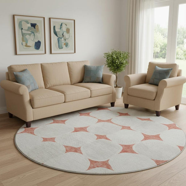 HomeRoots 8' Salmon and Ivory Abstract Geometric Round Rug - Washable, UV Protected, Perfect for High-Traffic Areas! 669231