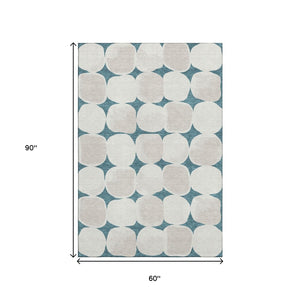 HomeRoots 5' X 8' Teal And Ivory Abstract Geometric Rug - Washable, UV-Protected, Perfect for Busy Homes! 669242