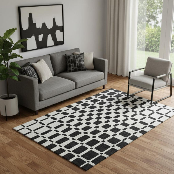 HomeRoots 5' X 8' Stylish Black & Ivory Geometric Area Rug – Washable, UV-Protected, Perfect for High-Traffic Spaces 669254